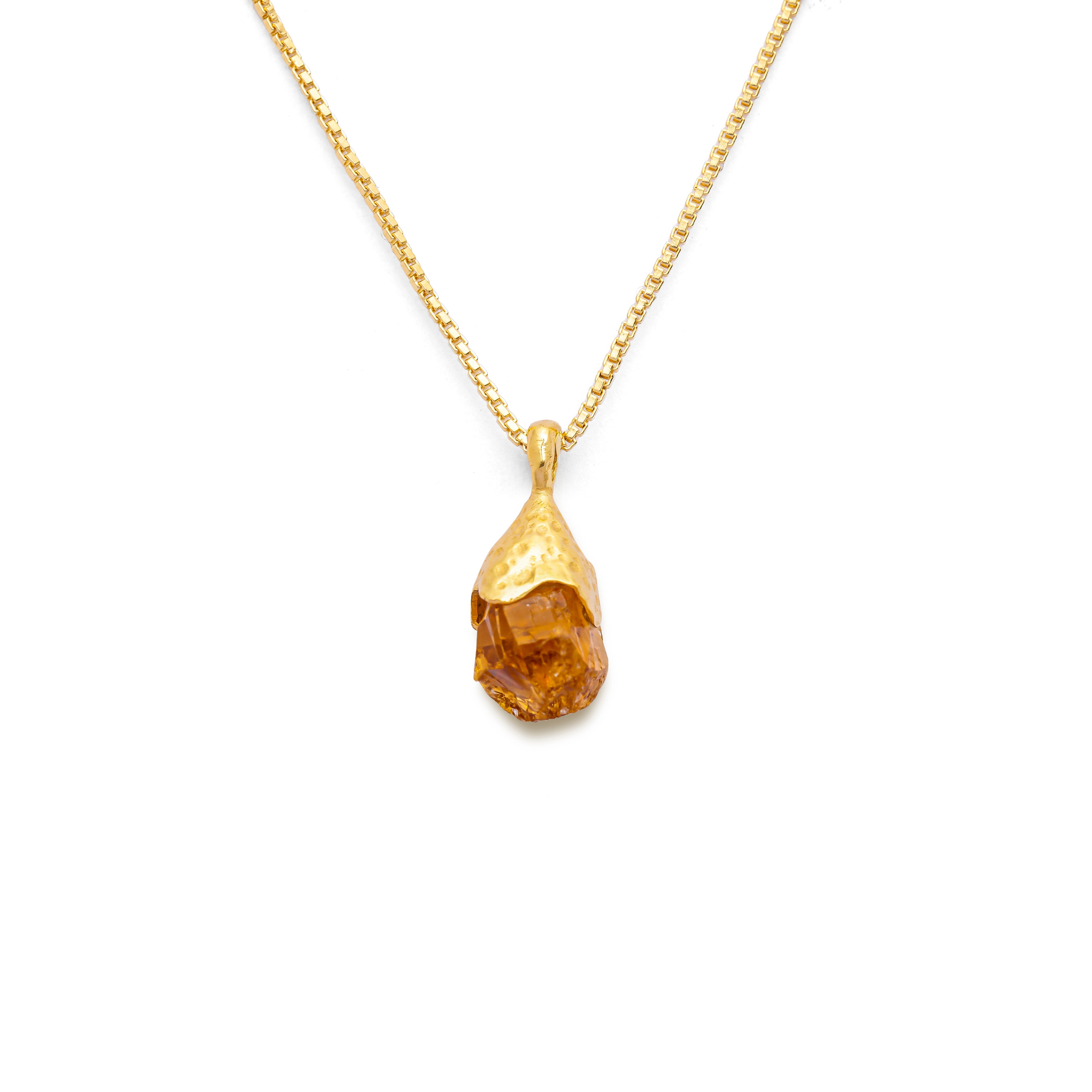 Orange citrine pendant raw nugget on a 18k gold vermeil box chain on a white background