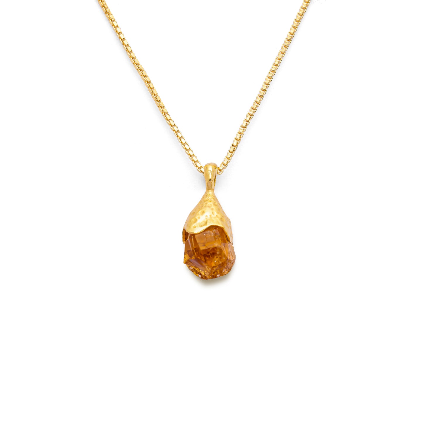 Orange citrine pendant raw nugget on a 18k gold vermeil box chain on a white background