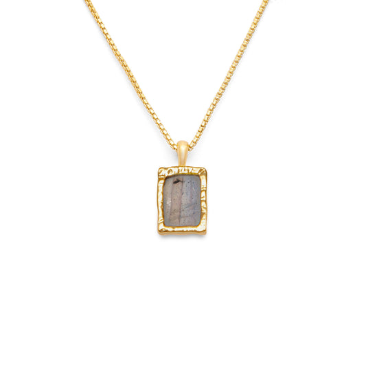 Rectangle flat labradorite pendant on an 18k gold box chain on a white background